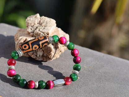 Nine-eye dZi bead with Golden Swan 8mm beads – A Symbol of Strength, Protection & Prosperity. A Beacon of Luck and Divine Favor