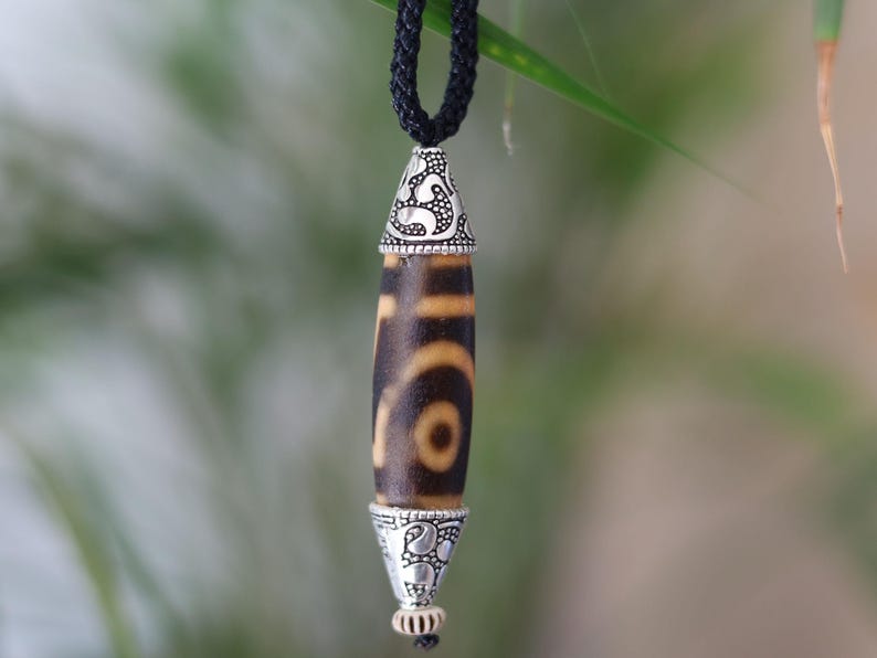 Rare to find, Old The Two-Eye dZi bead is a powerful symbol of love, marital harmony, and balanced relationships.
