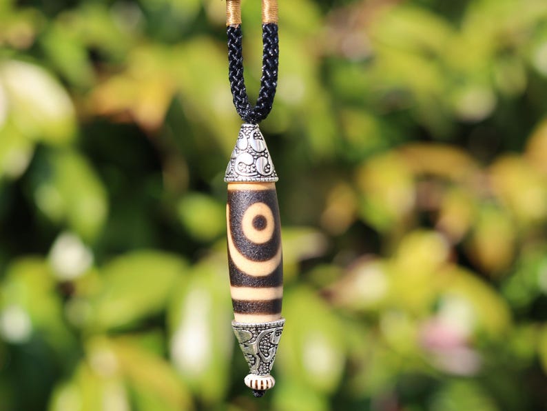 Rare to find, Old The Two-Eye dZi bead is a powerful symbol of love, marital harmony, and balanced relationships.
