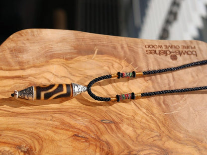 Rare to find, Old The Two-Eye dZi bead is a powerful symbol of love, marital harmony, and balanced relationships.