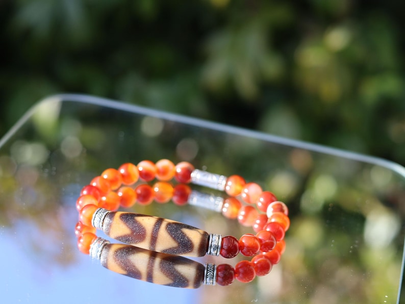 Old Double DZI Bracelet with Red Agate was known as the Warriors Stone. face challenges and adversities, protective amulets