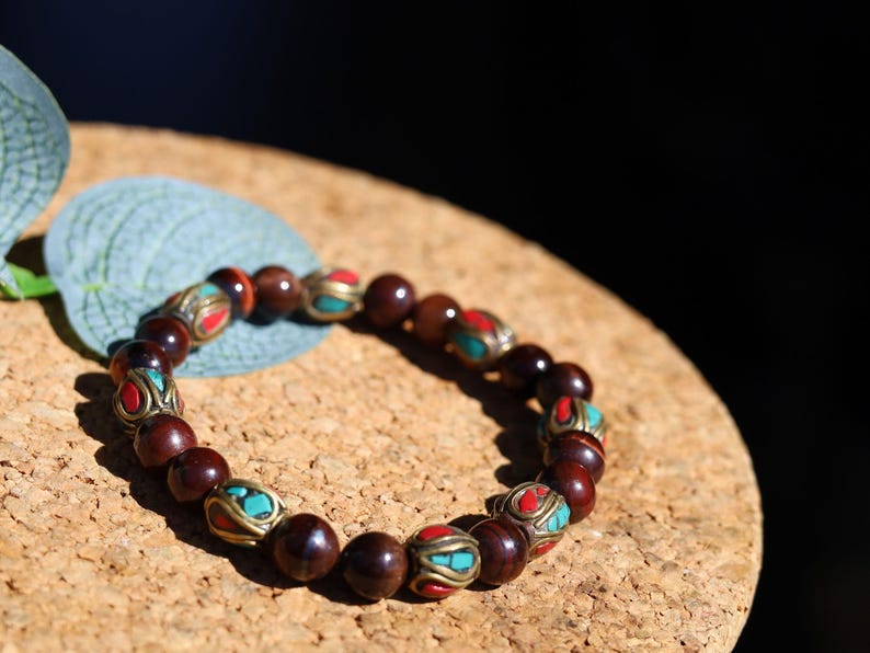 Wajakaa Design | Tiger Eye Bracelet with Handmade Nepalese Brass Beads | Turquoise & Coral Inlay.