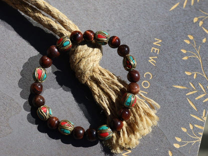 Wajakaa Design | Tiger Eye Bracelet with Handmade Nepalese Brass Beads | Turquoise & Coral Inlay.