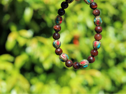 Wajakaa Design | Tiger Eye Bracelet with Handmade Nepalese Brass Beads | Turquoise & Coral Inlay.