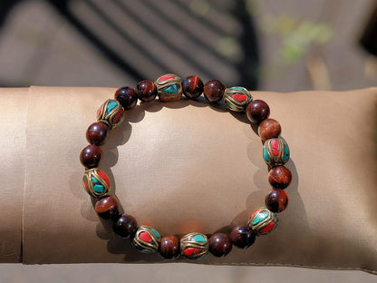 Wajakaa Design | Tiger Eye Bracelet with Handmade Nepalese Brass Beads | Turquoise & Coral Inlay.