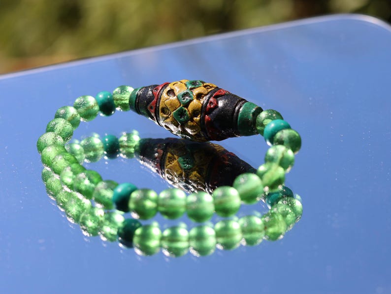Andean Diamond Barrel Bead Bracelet | Moldavite • Tibetan Green Turquoise Prayer Beads.A sacred fusion. reflecting centuries of Quechua