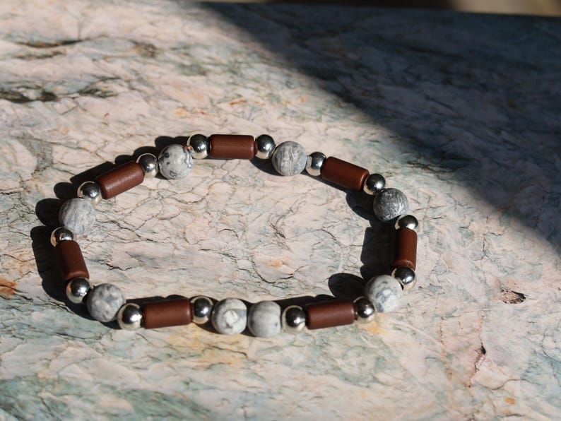 Frosted Picasso Stone & Rosewood Bracelet –Natural Balance and Style. Embrace the beauty of natural textures with this Frosted Picasso Stone