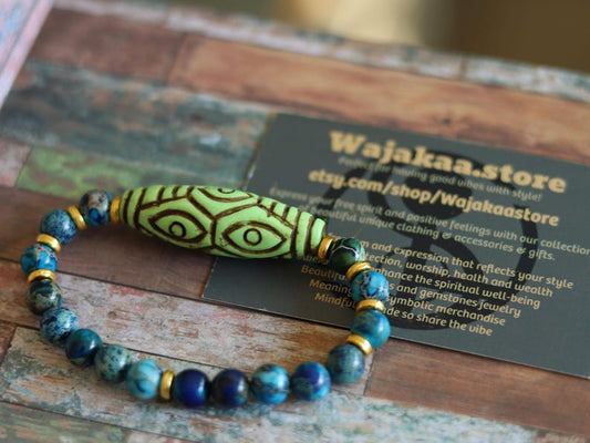 Tibetan Six Phoenix’s Eyed Bracelet – Hand-Carved Turquoise with Sea Sediment Turquoise Bead. Transformation, protection, and enlightenment.