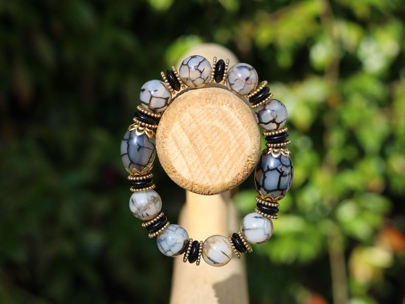 Tibetan Crackle Agate Bracelet – Golden Harmony Collection. Embody strength, wisdom, and grounding energy with this stunning item