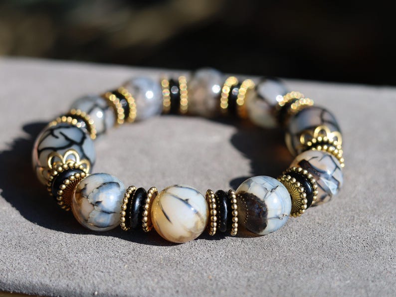 Tibetan Crackle Agate Bracelet – Golden Harmony Collection. Embody strength, wisdom, and grounding energy with this stunning item