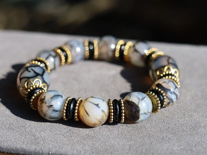 Tibetan Crackle Agate Bracelet – Golden Harmony Collection. Embody strength, wisdom, and grounding energy with this stunning item