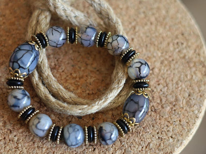 Tibetan Crackle Agate Bracelet – Golden Harmony Collection. Embody strength, wisdom, and grounding energy with this stunning item