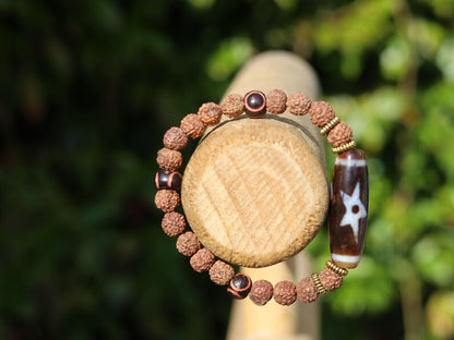 Tibetan “Sun, Moon & Star” Dzi Bead Bracelet – Rudraksha Energy Beads. Awaken your cosmic energy and inner peace with this rare bracelet