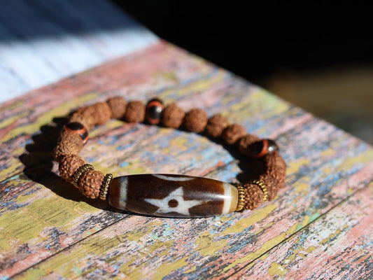 Tibetan “Sun, Moon & Star” Dzi Bead Bracelet – Rudraksha Energy Beads. Awaken your cosmic energy and inner peace with this rare bracelet