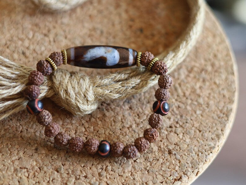 Tibetan “Sun, Moon & Star” Dzi Bead Bracelet – Rudraksha Energy Beads. Awaken your cosmic energy and inner peace with this rare bracelet
