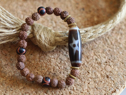 Tibetan “Sun, Moon & Star” Dzi Bead Bracelet – Rudraksha Energy Beads. Awaken your cosmic energy and inner peace with this rare bracelet