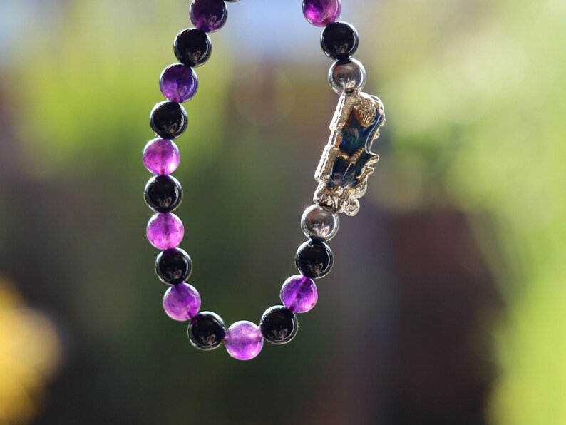 This Pixiu Amulet Bracelet features Jade | Amethyst | Black Onyx. believed to bring wealth,good fortune, and protection from negative energy