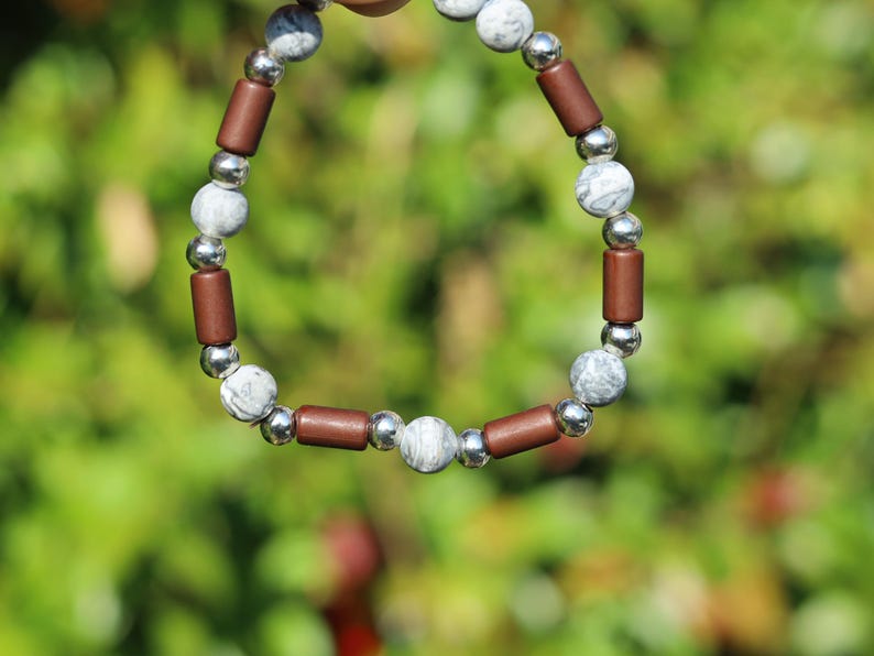 Frosted Picasso Stone & Rosewood Bracelet –Natural Balance and Style. Embrace the beauty of natural textures with this Frosted Picasso Stone
