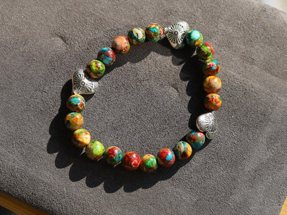 Colorful Sea Sediment Turquoise Bracelet – Tibetan Heart Design. Infuse your style with color, culture, and calm energy