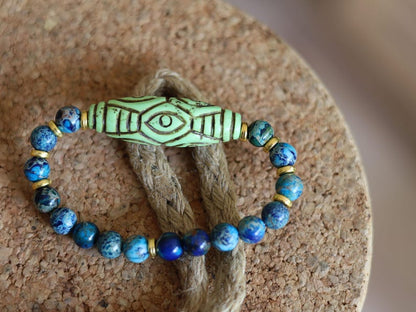 Tibetan Six Phoenix’s Eyed Bracelet – Hand-Carved Turquoise with Sea Sediment Turquoise Bead. Transformation, protection, and enlightenment.