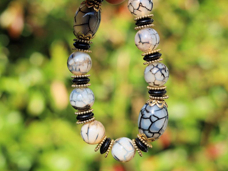 Tibetan Crackle Agate Bracelet – Golden Harmony Collection. Embody strength, wisdom, and grounding energy with this stunning item
