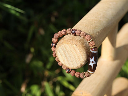 Tibetan “Sun, Moon & Star” Dzi Bead Bracelet – Rudraksha Energy Beads. Awaken your cosmic energy and inner peace with this rare bracelet