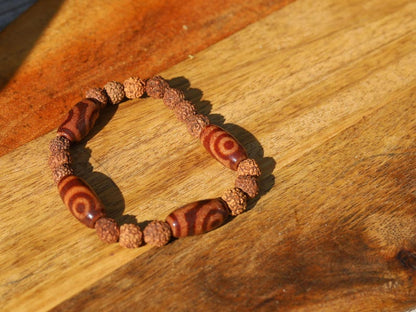 Tibetan Two-Eyed Dzi & Rudraksha Bracelet – Harmony and Unity. it represents harmony, love, and partnership