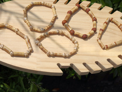 Bamboo bead wave. beige/sand color. Format: 16 mm x 6 mm. Beads made of bamboo with a nice print.